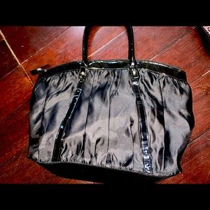 Black purse. By Rihanna